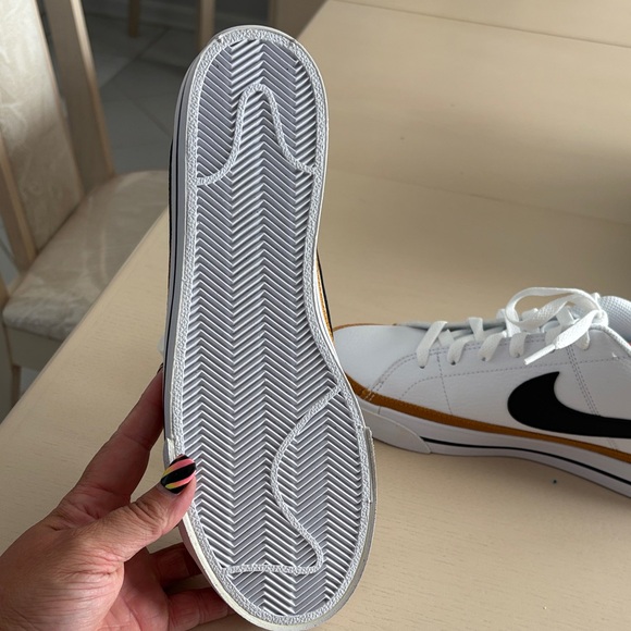 Nike women’s White and Black Sneakers with Gold Accents - Picture 7 of 8